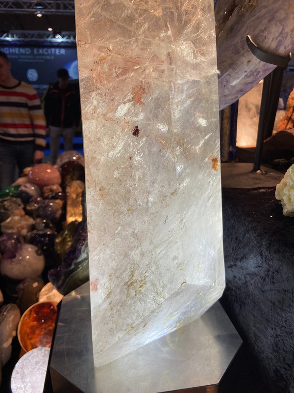 Rock crystal earth guardian crystal with many red, orange and yellow hematite inclusions