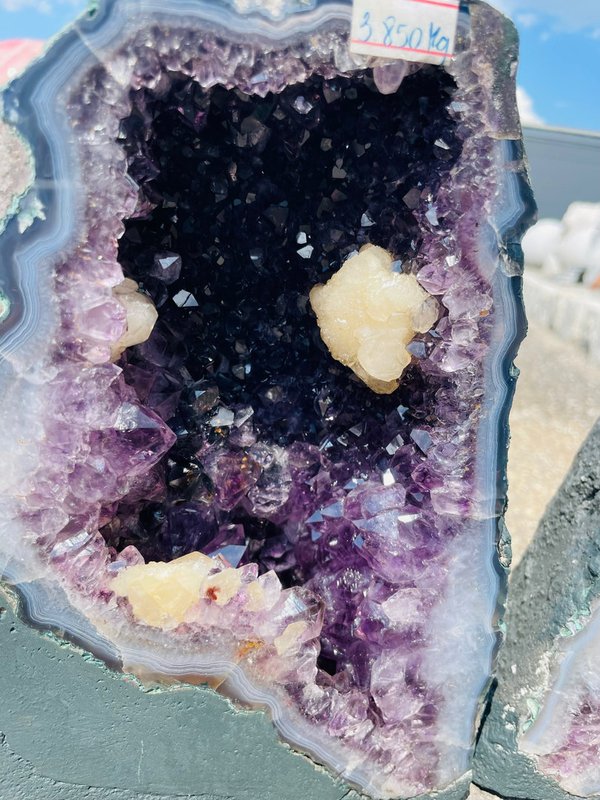 Great amethyst druse pair with many calcite flowers and blue calcedon