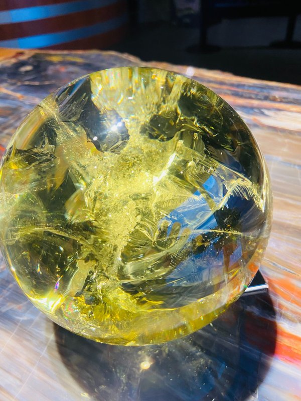 Beautiful citrine ball with rainbow colored inclusions