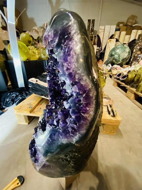 very dark Uruguay amethyst druse with large calcite and agate bloom