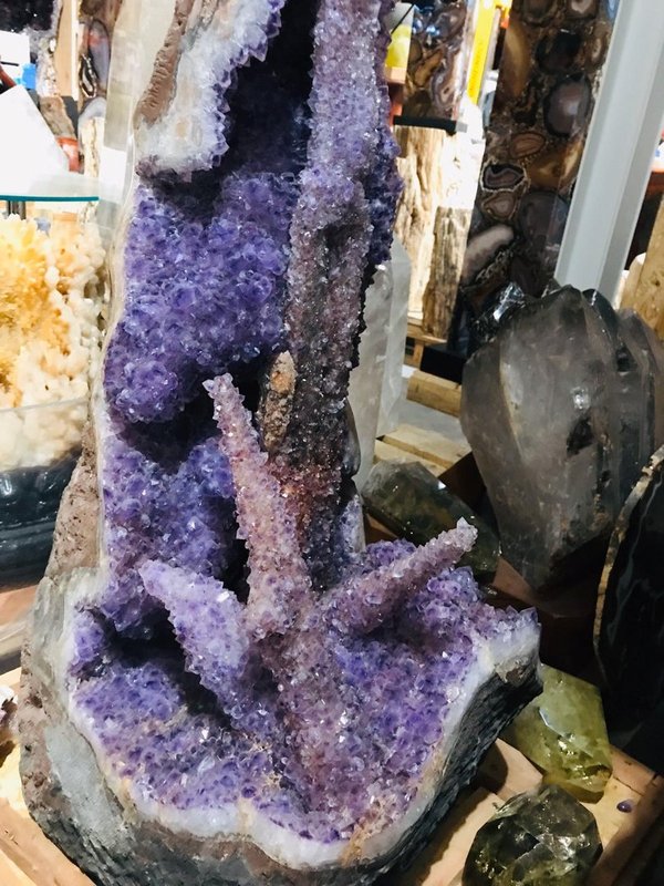 Amethyst druse with stalactite formations